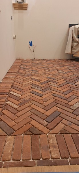 Herringbone brick pattern tile floor